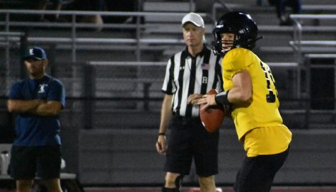 Lancers quarterback senior Luke Duxbury looks for targets to throw the football to during an Aug. 22 scrimmage against Yorba Linda at the Buena Park High School stadium. Duxbury is among four Lancers ranked in the Orange County Register’s online Hot 150 high school football athletes. The Register rated him at 71, the highest among the other three Lancer football players. Photo taken by Accolade photographer Paul Yasutake.
