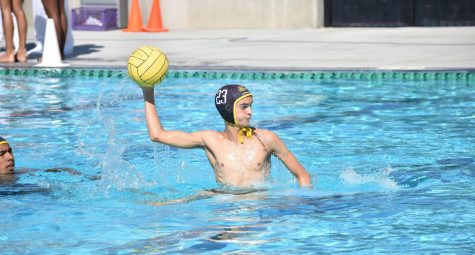 Utility player junior Jacob Brooks focuses his aim and prepares to throw the ball during the teams first home game against Esperanza High School Aug. 27. Photo taken by Accolade photographer Paul Yasutake.