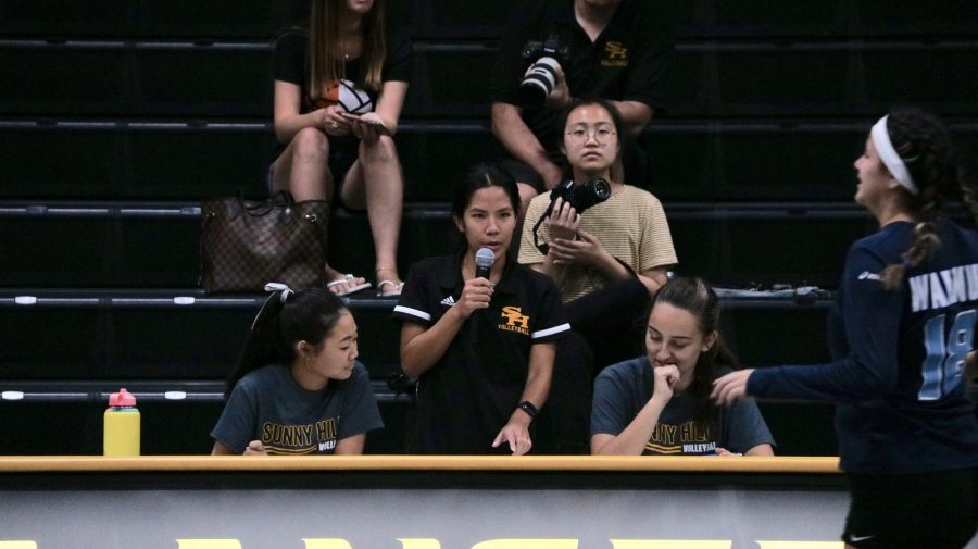 Girls volleyball frosh-soph coach Allison Wong (center) announces the roster for a varsity game against Walnut High School Aug. 22 in the Sunny Hills gym. Photo taken by Accolade reporter Andrew Ngo.