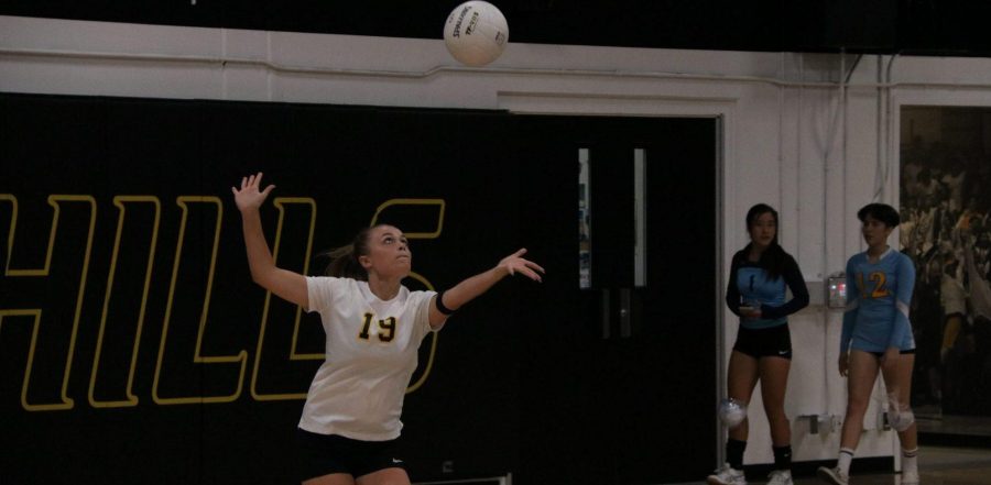 Defensive Specialist Calie Koehn serves the ball in the air while in her serving motion during a 3-0 loss to Walnut High School Aug. 22. (Photo taken by Accolade news editor Tyler Pak)