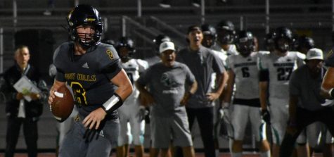 Sunny Hills quarterback senior Luke Duxbury leads the Lancers to a 55-20 victory over Irvine High School in an away game Sept. 6. Duxbury bounced back from a 36-35 loss in his season home opener Aug. 30 against Aliso Niguel. Photo taken by Accolade photographer Paul Yasutake.