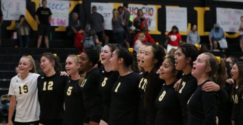 Members of the girls volleyball team band together while singing the school's alma mater following their final home Freeway League game Oct. 14 against Fullerton. Photo taken by Accolade photographer Paul Yasutake