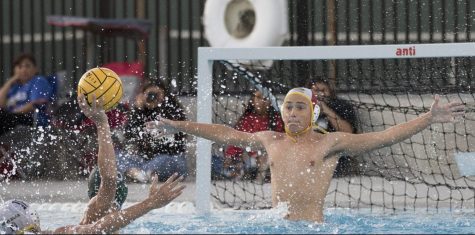 Sunny Hills goalie junior Josh Beutter rises out of the water to block a shot by a Buena Park attacker during an Oct. 2 home game in which the Lancers won, 10-4. Photo by Accolade photographer Paul Yasutake