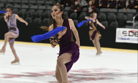 Junior Irene Lee performs in her routine during the 2019 National Theater on Ice competition in Alabama June 28. She is wearing dark markup as part of the routine. Photo reprinted with permission from Kayla Heo.