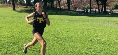 Sunny Hills girls cross country runner freshman Jeweliet Fields races toward the finish line during the Freeway League Cluster Oct. 9 at Ralph B. Clark Park in Fullerton. Fields finished 13th with a time of 20.48.93 and helped the Lady Lancers take first place during the race. Photo taken by Accolade staff reporter Kristima Aryal