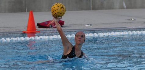 Junior goalkeeper Lauren Gruber passes the ball to a teammate during practice Nov. 14 at the Sunny Hills pool. Photo taken by Accolade photographer Paul Yasutake