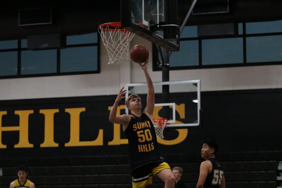 Senior guard Adam Reuter goes up for a layup during practice in the Sunny Hills gym Nov. 14. Photo taken by Accolade photographer Paul Yasutake