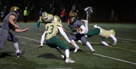 Running back and defensive back senior Jun Ahn (center) avoids Santa Barbara special teams players during a kickoff return while linebacker junior Carson Irons (left) blocks in front of him. Ahn had 142 rushing yards on 30 carries during the Lancers' 24-21 victory over the Dons in the CIF-Southern Section Division 8 championship game at San Marcos High School stadium Nov. 30. Photo taken by Accolade photographer Paul Yasutake