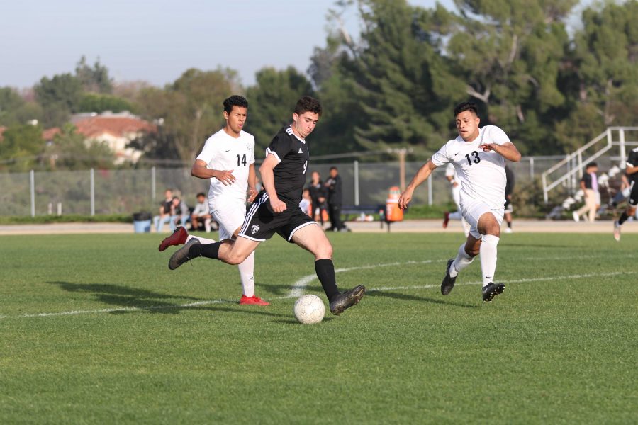 Forward freshman David Rezko winds up for a shot on goal attempt while inside the penalty box during a Jan. 24 Freeway League game against Buena Park at the Sunny Hills field. Photo taken by Accolade photographer Paul Yasutake