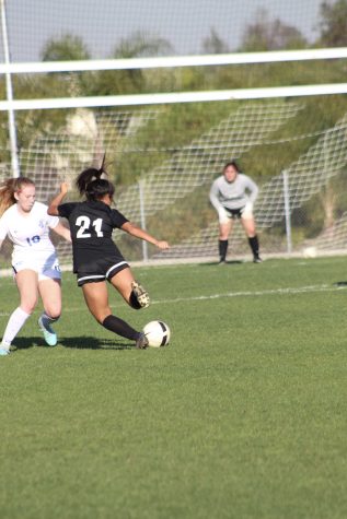 Midfielder senior Meghan Legayada attempts to fires the ball toward the goal during a 5-0 blowout against La Habra Jan. 29 at the Sunny Hills field. Photo taken by Accolade photographer Brianna Zafra
