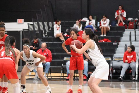 Guard senior Annika Johnson (right) attempts to shoot a freethrow during the game against Fullerton on Feb. 4 at the Sunny Hills High School gym. Photo taken by Accolade photographer Brianna Zafra