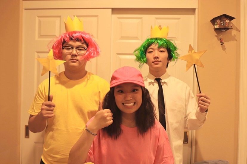 Junior Albert Chung (left) and senior Kenji Williams stand behind junior Carrie Cheng during their filming of Chengs ASB campaign video. Cheng, who got the most votes for ASB treasurer March 13, was cosplaying as Timmy Turner, the protagonist of The Fairly OddParents cartoon TV series.  Image used with permission from Rodney Cho.