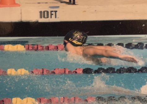 Former Lancer swimmer Lawrence Mao's mother took this picture of Accolade photo editor and swimmer senior Megan Shin as she swam the 100 fly during the Mt. Sac Meet of Champions on April 13, 2019. Shin laments the loss of a senior night meet to recognize the 12th-grade athletes in spring sports because of school closure until May 1 to stem the threat of COVID-19.