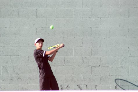 Boys tennis singles player freshman Owen Taylor prepares to hit a backhand during a March 3 match against Whitney. Taylor aims to play in the April 21-26 Ojai Tournament, but concern over how to stop the spread of the coronavirus has the event's status in jeopardy. Image taken by Accolade photographer Brianna Zafra.