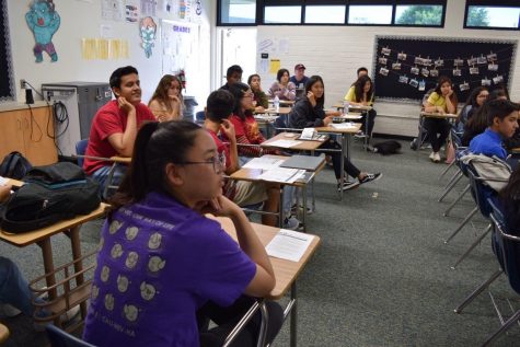 Senior Jenny Lee listens a Lieutenant Governor Ali Orouji, the governor for region 3 division 4 South, during the regional training conference on October 12, 2019.