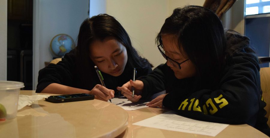 Freshman Maggie Kho (left) and junior Hannah Kim take a practice Codebusters test Feb. 14 at Kho’s house after school, working on improving their decrypting skills together on a timed-bonus question to prepare for the regional Science Olympiad competition the next day. Though the Sunny Hills team made history in being the schools first squad to advance to the Southern California state tournament, the April 4 competition was canceled a month ago because of the COVID-19 pandemic. Image posted with permission from Anika Madan.