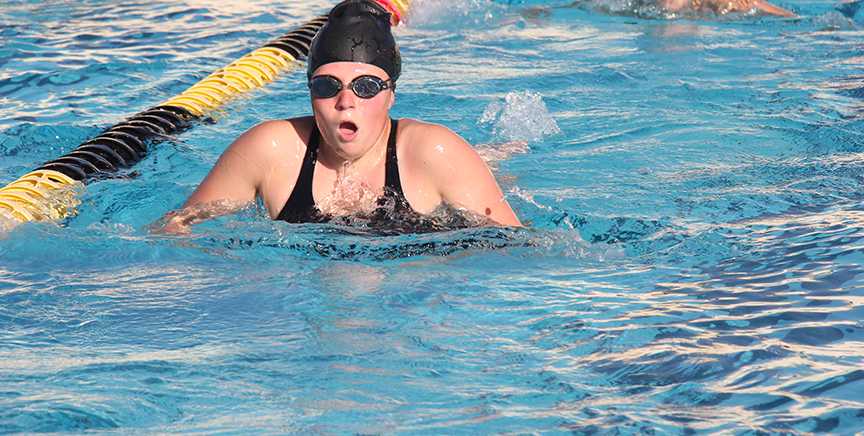 Sophomore Rachel Green takes a breath during her breast stroke practice in the Sunny Hills aquatics pool. Born deaf, Green relies on a light to go off as her starting signal when she competes in individual heats. Photo taken by Accolade photo editor Megan Shin