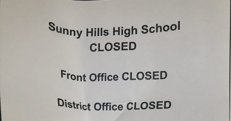 Printed signs like this are taped outside Sunny Hills High School's main office doors between Rooms 3 and 7 as a reminder to the community that the campus will remain closed through the summer unless California Gov. Gavin Newsom lifts his stay-at-home orders in response to the coronavirus pandemic. Photo taken by Accolade adviser Tommy Li