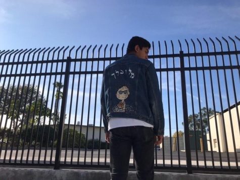 A student models Christian Aguirre's painted denim jacket to advertise his growing business. Reprinted with permission from Christian Aguirre