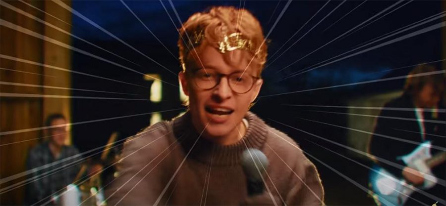 Cavetown's lead singer Robin Skinner in a close-up during the music video of one of his recent songs, 