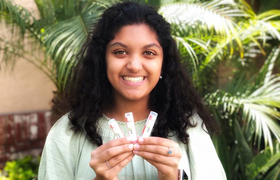 Sophomore Divya Bharadwaj shows the various flavors of her lip balm products. Her Didi Balms has come to a halt like several non-essential ones statewide because of the novel coronavirus crisis, but Bharadwaj is hoping to keep her business afloat through online sales. Image posted with permission from Kiran Bharadwaj.