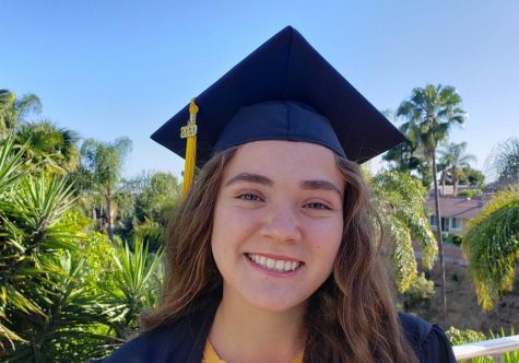 Senior Audrey Gass graduates as one of the 12 valedictorians for the class of 2020 at her house on May 20. Photo reprinted with permission from Audrey Gass