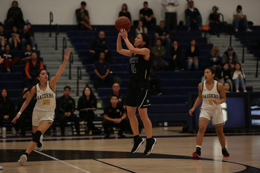 Guard senior Annika Johnson (center) shoots during a 42-35 win at Sonora on January 24. The win was Sunny Hills first against the Raiders since the 2011-2012 season. 