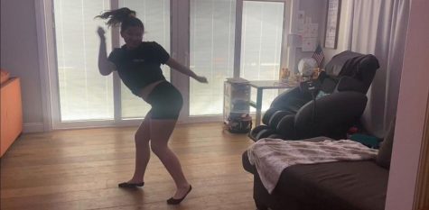 Sophomore Sydnee Tallant records the new Pep Squad routine on video May 6 as part of her audition application to join a combined cheer and song team at Sunny Hills.