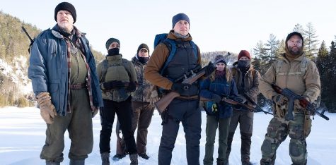 Locked and loaded, the survivalist trainees led by Alain (left) get ready for their next training exercise in Netflix's