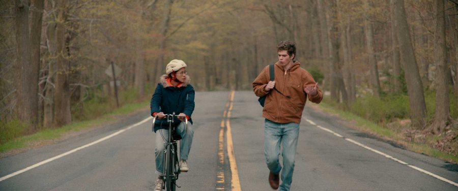 In the new coming of age movie "The Half of It," Peter stops Ellie on her bike ride home to propose an agreement on his love letter to Aster. Image posted with permission from Netflix. 