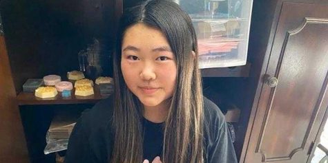 Suh Lin Hong sits in front of the cabinet of her Fullerton home, where she has stored the soap she has made after the spread of the novel coronavirus forced Sunny Hills High School to close down in mid-March. Before school closure, she had made $80 selling her Bunny Bars on campus through word of mouth and through her Instagram story page (@bunny.bars). Image used with permission from Woojin Hong.