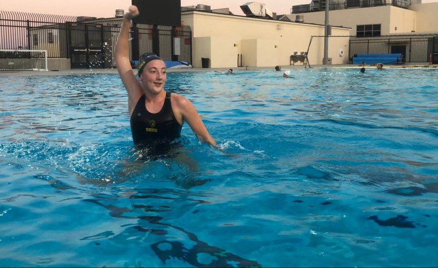 Although girls water polo utility player sophomore Sophia Smith cannot use a ball to pass to any of her teammates, she still winds up to practice her form Aug. 26 at Sunny Hills’ aquatics center. Unlike other sports, those in the pool are permitted to exercise without wearing a mask because they are in the water.