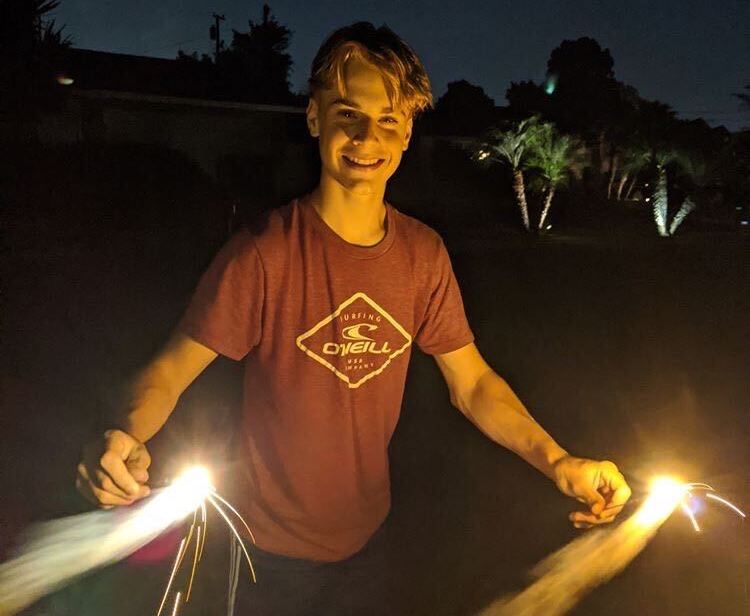 Junior Luke Weinreich, who is in opposition of banning safe and fireworks, plays with sparklers in celebration of the Fourth of July this past summer in his neighborhood in Fullerton. Fullerton voters will decide on Measure U, which calls for the prohibition of the sale and use of these fireworks.