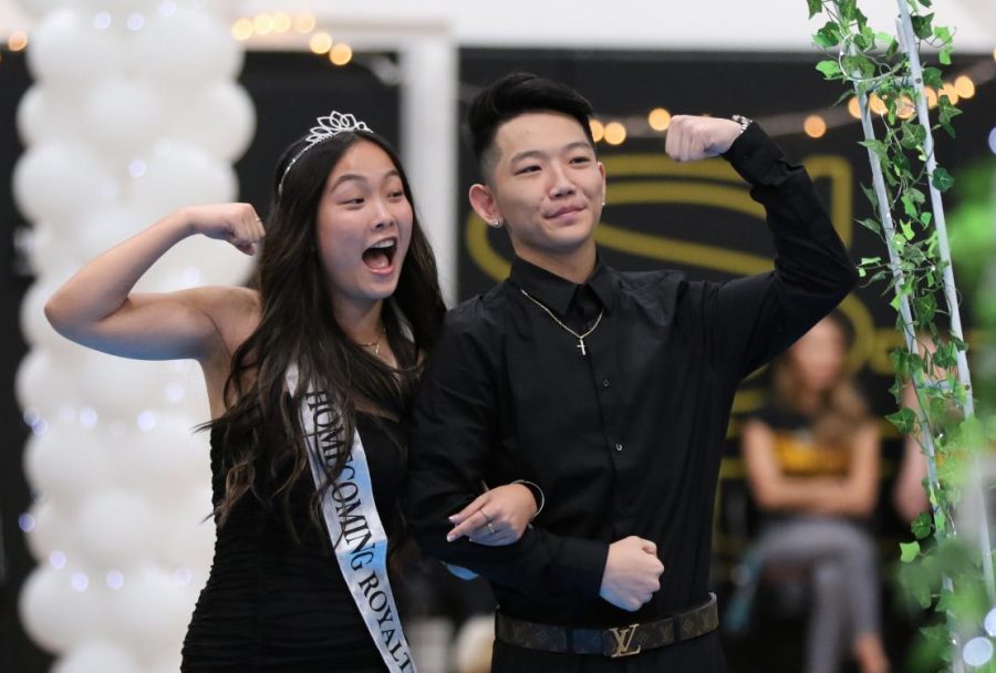 Homecoming princess Rachel Kim (left), escorted by Kenji Williams (both Class of 2020), celebrate their walk around the gym during the 2019 ASB-organized assembly. Because football got postponed to the spring semester of 2021, the ASB has decided to move its traditional fall homecoming events to the week of Feb. 9.