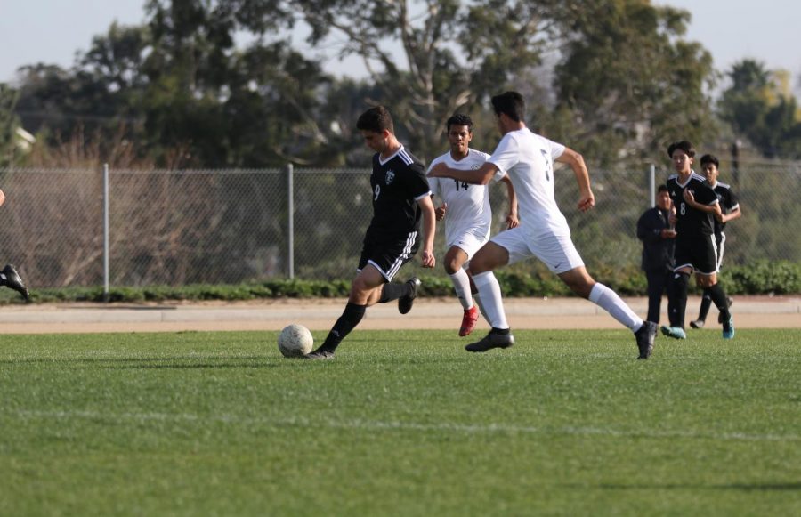Forward and then-freshman David Rezko (left) kicks the ball during a 2-1 home victory over Buena Park on Jan. 24. The sophomore, along with his new teammates, will vie for a second Freeway League title in as many years when their season begins next February. Meanwhile, on Sept. 3, head coach Mike Schade held tryouts drawing 13 candidates.