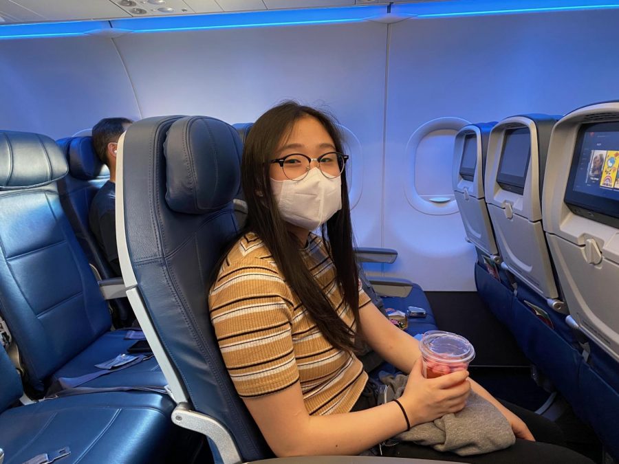 Buckled+and+ready+for+her+first+cross-country+flight+during+the+coronavirus+pandemic%2C+senior+Karen+Lee+sits+in+her+seat+on+Delta+Air+Lines+as+she+waits+for+the+pilot+to+take+off+from+Los+Angeles+International+Airport.+The+Accolade%E2%80%99s+online+graphics+editor+was+excused+from+school+for+part+of+Aug.+14+and+the+whole+day+of+Aug.+17+so+she+could+travel+with+her+parents+and+older+brother%2C+Daniel%2C+to+Georgia%E2%80%99s+Emory+University+in+Atlanta%2C+where+Lee%E2%80%99s+brother+will+be+attending+his+first+year+of+college.+Like+several+other+businesses+nationwide%2C+airline+passengers+are+required+to+wear+a+face+mask+before+they+board+their+flight.