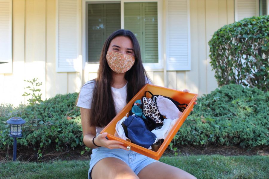 Senior Meagan Kimbrell takes out her collection of 30 masks that she has bought either from Amazon or Target since the COVID-19 pandemic in mid-March. Though Kimbrell does not plan to return to campus Nov. 2 for hybrid learning, she still values mask fashion and will continue to promote her new finds on social media.