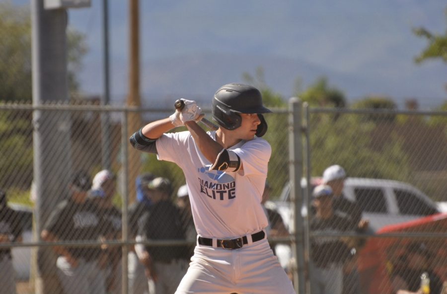 Lancer baseball shortstop, senior Symon Tabello, gets ready to hit one out of the park at an Aug. 11 tournament in Saint George, Utah. Since the coronavirus pandemic forced an early end to the spring baseball season and a delay in the high school ‘spring’ season to 2021, Tabello resorted to traveling with his club team, Diamond Elite, and competing in out-of-state tournaments in hopes of catching the attention of college recruiting scouts.