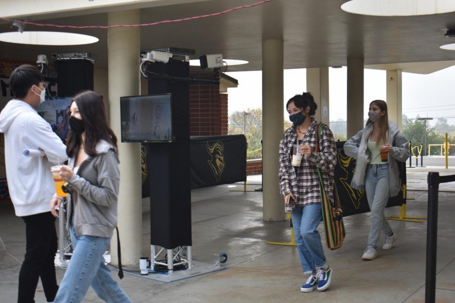Students walk through the new, $15,000 thermal cameras between the 20s wing and the office on Nov. 2, the first day of the hybrid schedule at Sunny Hills.
