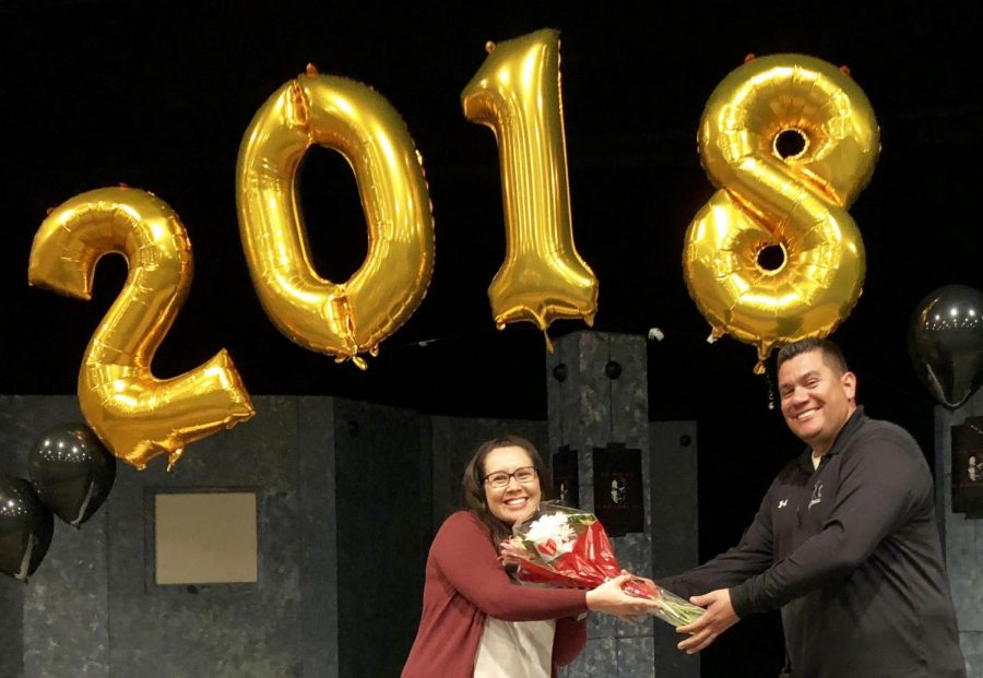 Sonya Joyce (left) accepts a bouquet of flowers from head custodian Daniel Rodriguez in February of 2018 when Joyce received the most votes from the Sunny Hills staff for classified employee of the year. The 2017-2018 school year was also when Joyce was first hired as a site technician on campus in charge of servicing technology issues. Joyce retired from the position Jan. 22.  