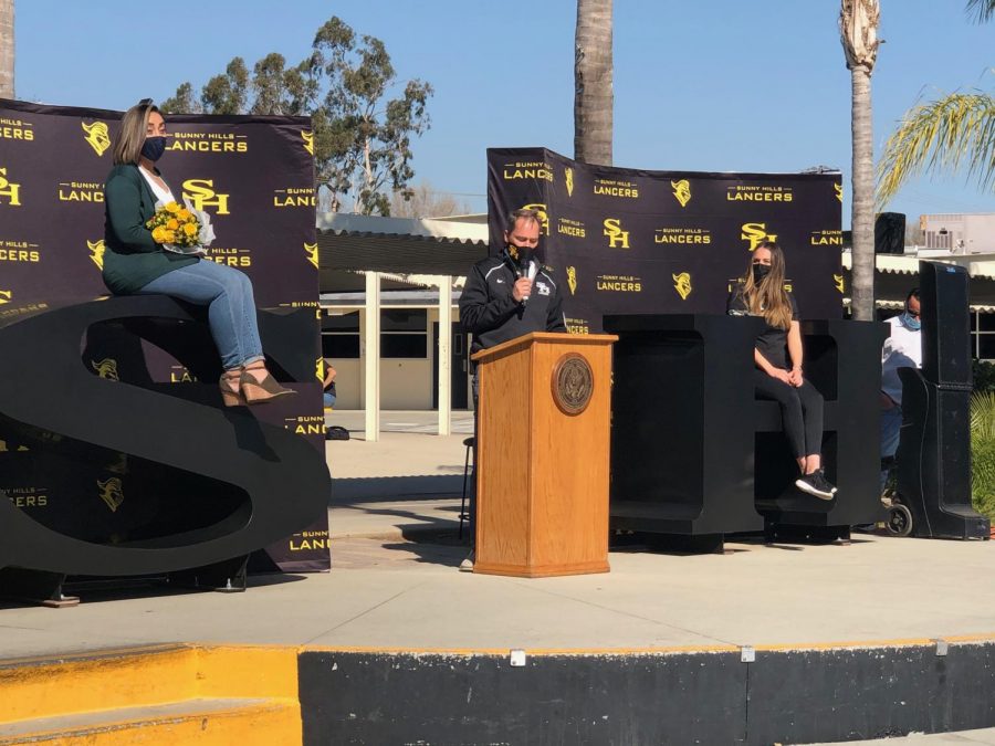 Keeping with the campus’ health and safety protocol of remaining six feet apart, principal Allen Whitten (center) leads a ceremony Thursday during break announcing Sunny Hills’ employees of the year.