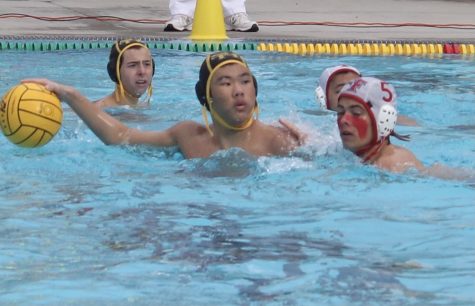 Sunny Hills utility player junior Andrew Lee looks to pass the ball to one of his teammates during a Wednesday, March 3, home game against Fullerton Union High School. The Lancers lost their first game of the season 17-4.