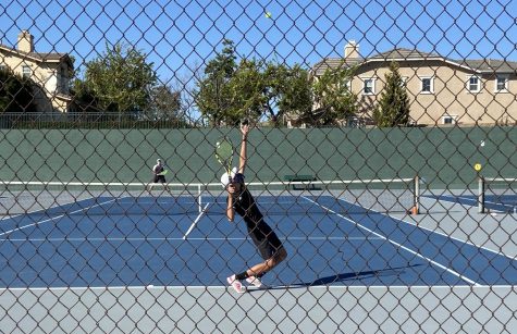 The Lancers’ No. 1 singles player, sophomore Owen Taylor, serves during a 6-2 victory over El Dorado’s No. 1 singles player, Nathan Chung. Taylor would win one of his two sets en route to a 14-4 Sunny Hills victory over the Golden Hawks on March 1.