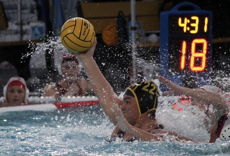 Sunny Hills girls water polo utility player senior Sydney Sereg fights off two Fullerton Union High School defenders while winding up to shoot the ball during a Wednesday, March 3, home game. Sereg scored 10 of the 19 points against the Tribe during the Lady Lancers’ season debut. 