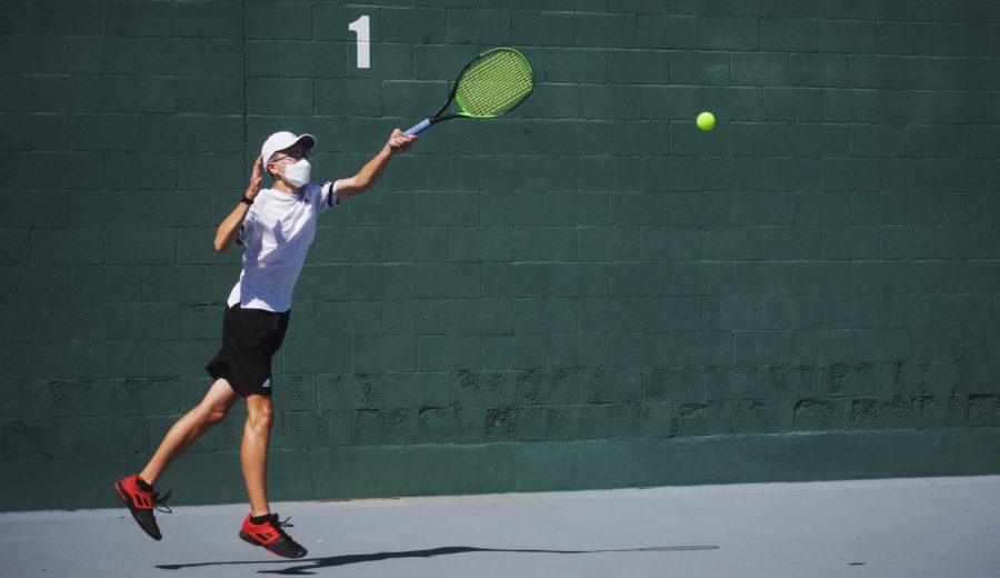 The Lancers’ No. 1 singles player, sophomore Carson Lee, returns a serve with a forehand during a 6-0 victory over Fullerton’s No. 1 singles player, junior Nathaniel Lee. Carson Lee would win all of his three sets, which contributed to a 15-3 Lancers victory over the Indians on April 8.
