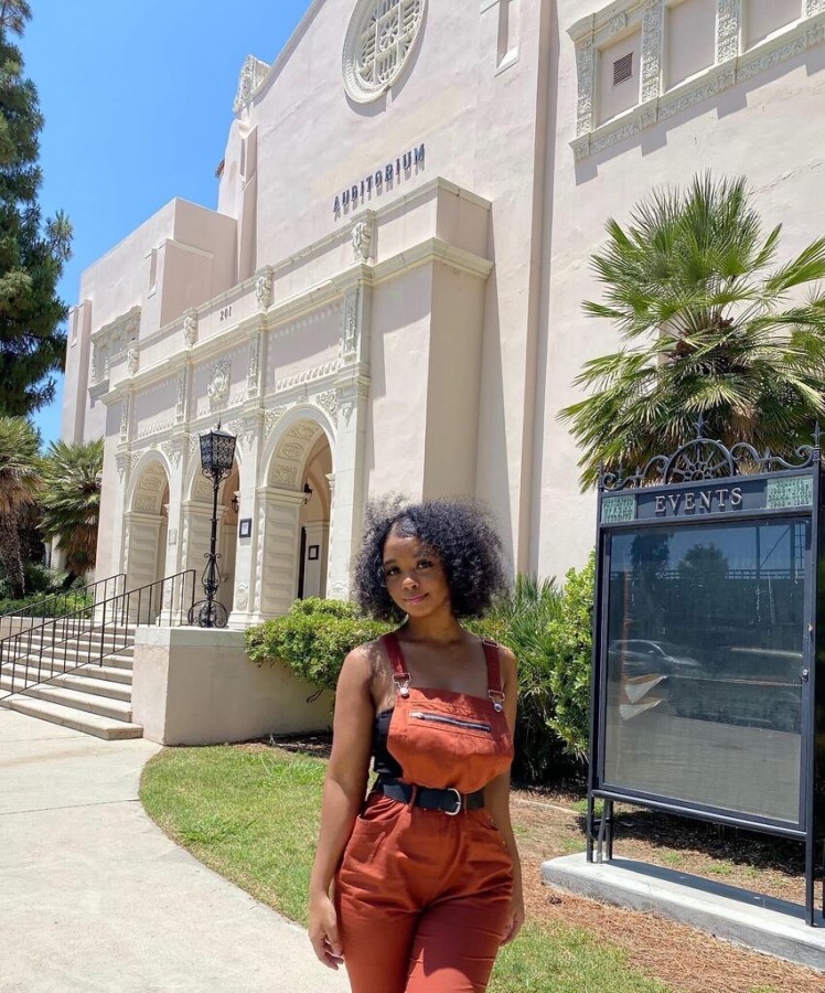 Sunny Hills alumna Jackie Logwood stands in front of the Fullerton Auditorium June 19, three days after the Fullerton Joint Union High School District board of trustees voted unanimously to remove Louis E. Plummer’s name from the building. Logwood had created an online petition seeking the change in name after Plummer was alleged to have been involved with the KKK.