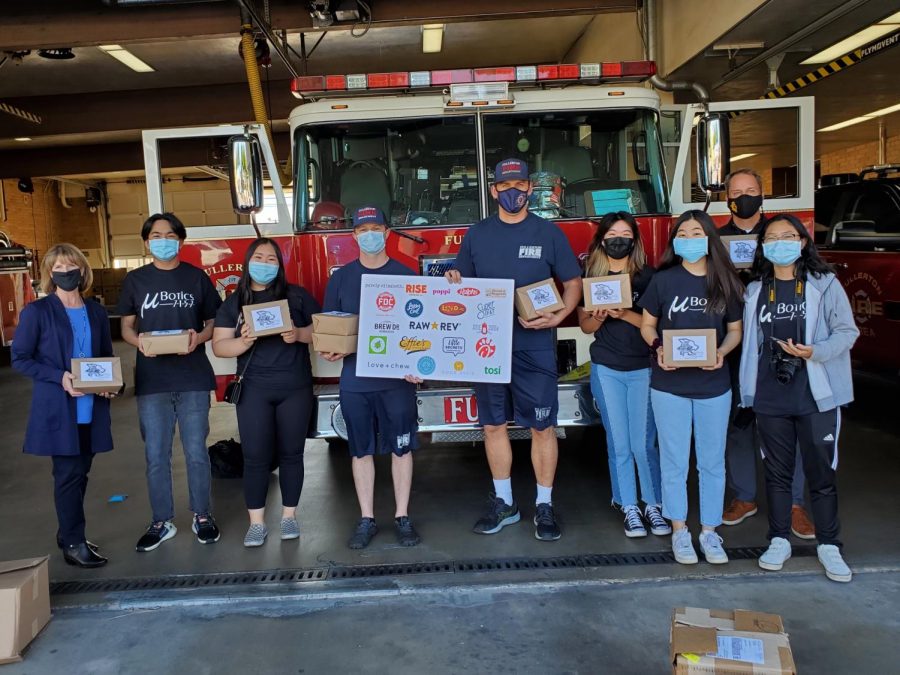 The Sunny Hills and Brea Olinda robotics team, along with principal Allen Whitten (top right corner of the group) and a few firefighters held the care packages that were delivered to the frontline workers on Jan. 18, Jan. 20 and Jan. 22 for their service during the COVID-19 pandemic.