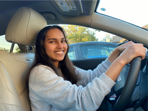 Junior Manishi Jayasuriya celebrates getting her driving permit from the Department of Motor Vehicles [DMV] in Fullerton. Jayasuria has been waiting for a month to take her DMV permit test because the facility has been closed because of COVID-19 health and safety protocols. 