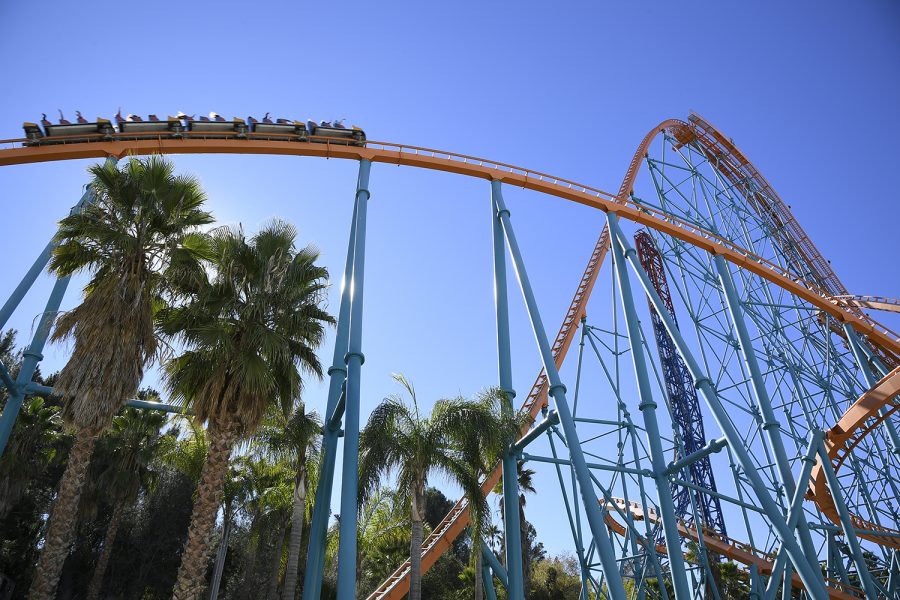 A roller coaster train swerves through Goliath’s track at the world’s fastest wooden coaster speed of 72 mph as it nears the record-breaking 180 foot drop. This was one of the many rides in which several park goers remained unmasked, which sparked concerns from those who preferred to strictly adhere to the Center of Disease Control’s COVID-19 regulations.