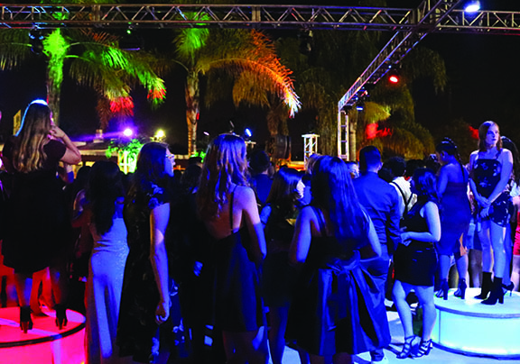 Students attending the 2017 homecoming dance take in the Aladdin-themed stage in the quad. While the Associated Student Bodys homecoming assembly Oct. 15 will be held indoors at the gym over three separate periods, the upcoming Oct. 16 homecoming dance will have to be an outdoor event because of COVID-19 health and safety protocols that require no more than 1,000 people in a building for an event. 